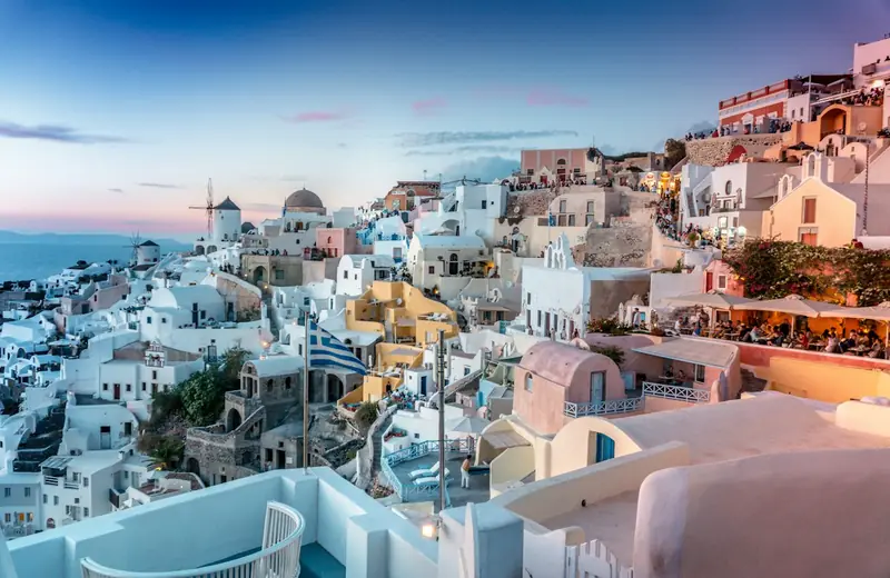 Whitewashed cliffside village overlooking the Aegean Sea in Santorini, Greece